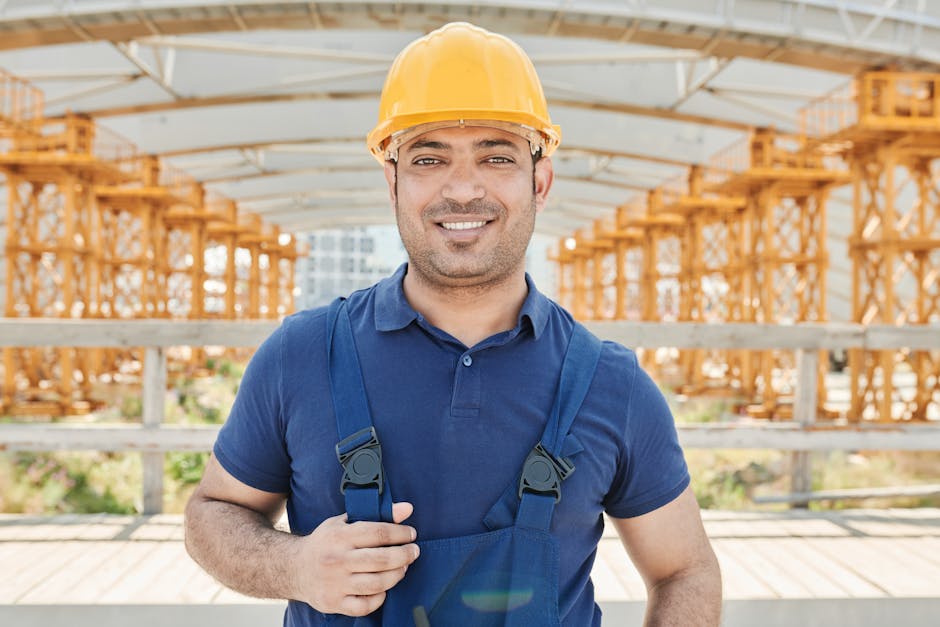 Friendly construction worker preparing for siding installation