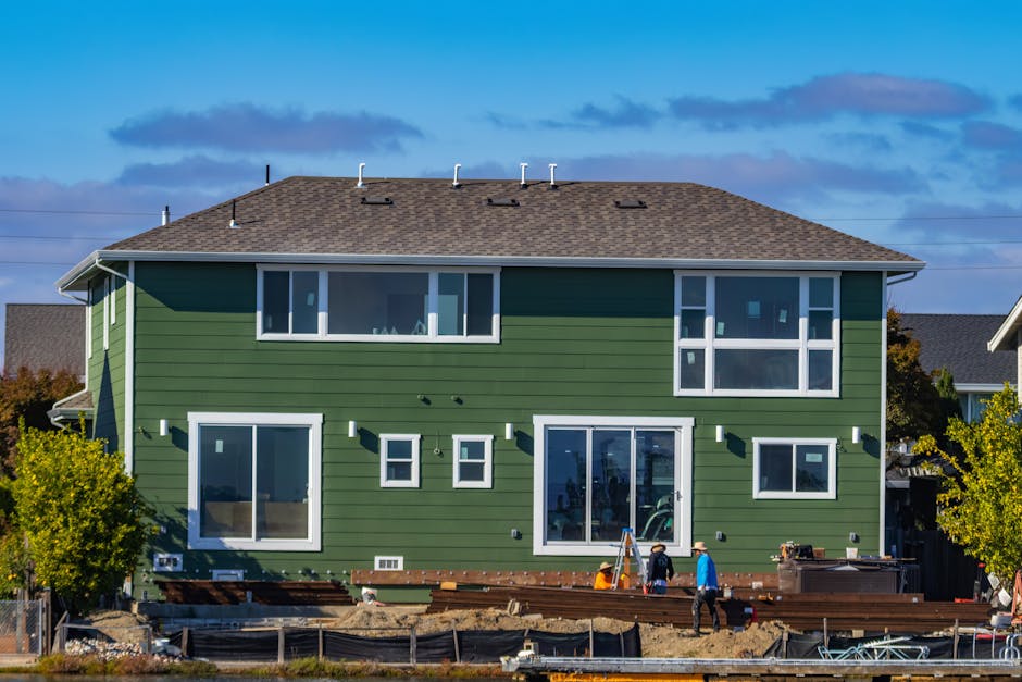 House siding installation process showing vinyl and fiber cement options